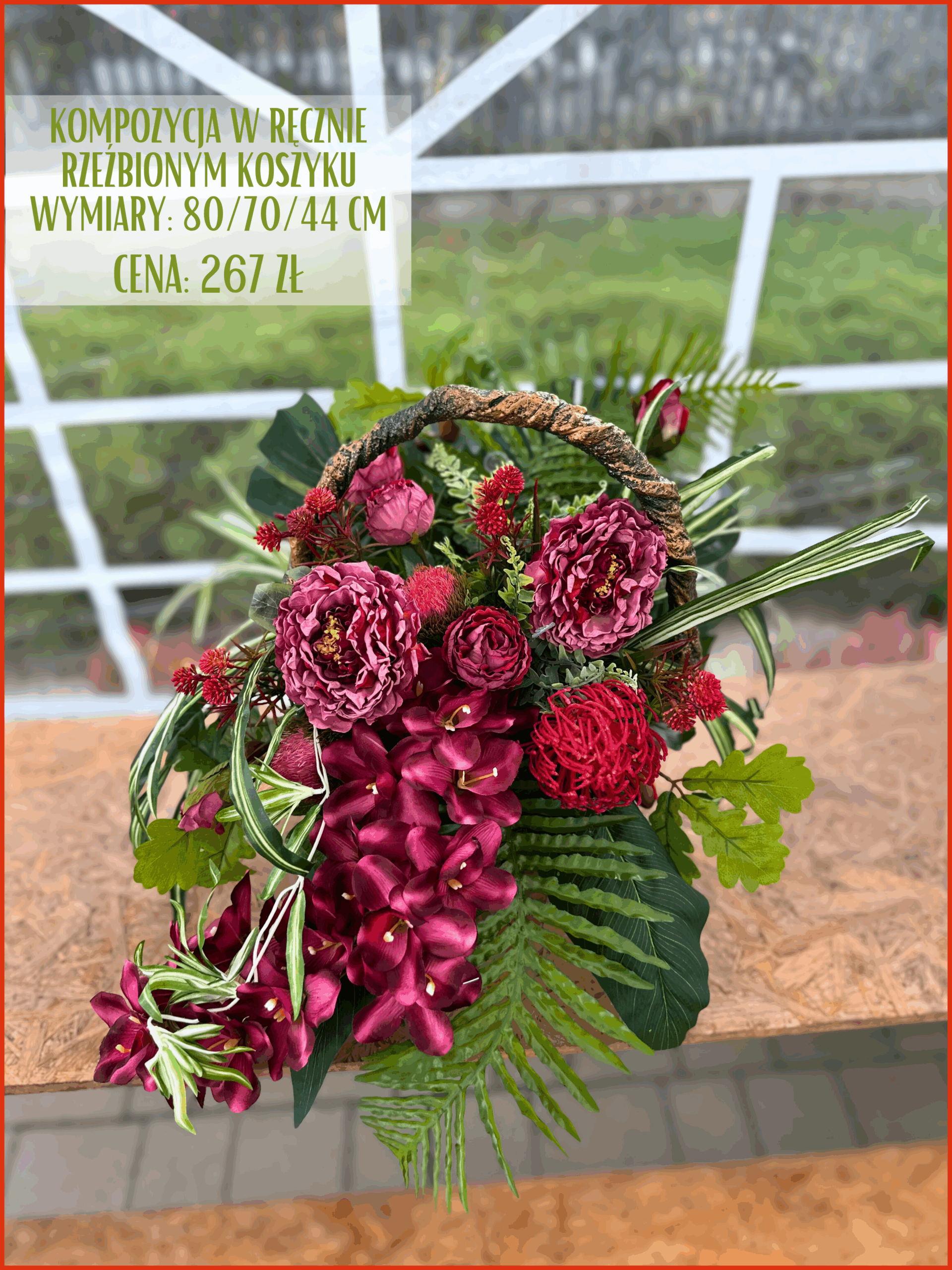 Kompozycja w donicy betonowej z czerwonymi różami i zielonymi dodatkami